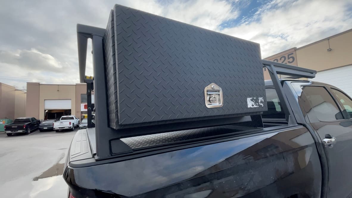 Close-up of custom black aluminum truck toolbox with lock installed in Surrey, BC