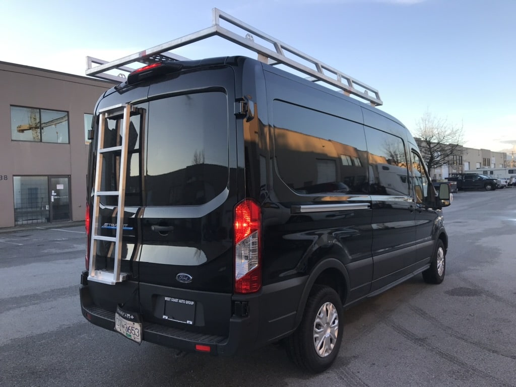 Ford Transit work van with aluminum roof rack and rear ladder installed by Ridge Rack in Surrey