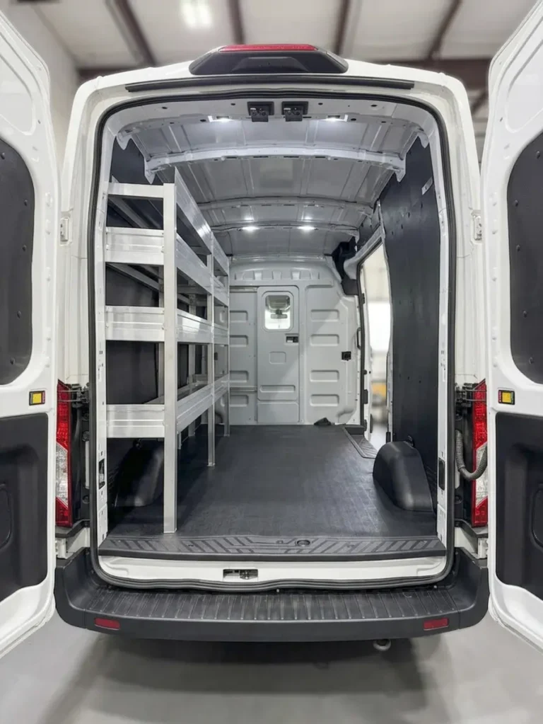 Custom shelving inside a work van, viewed from the rear doors